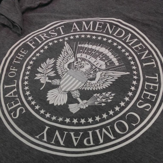 Seal of the First Amendment Tees Company